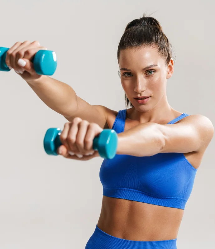 Person lifting a dumbbell during strength training